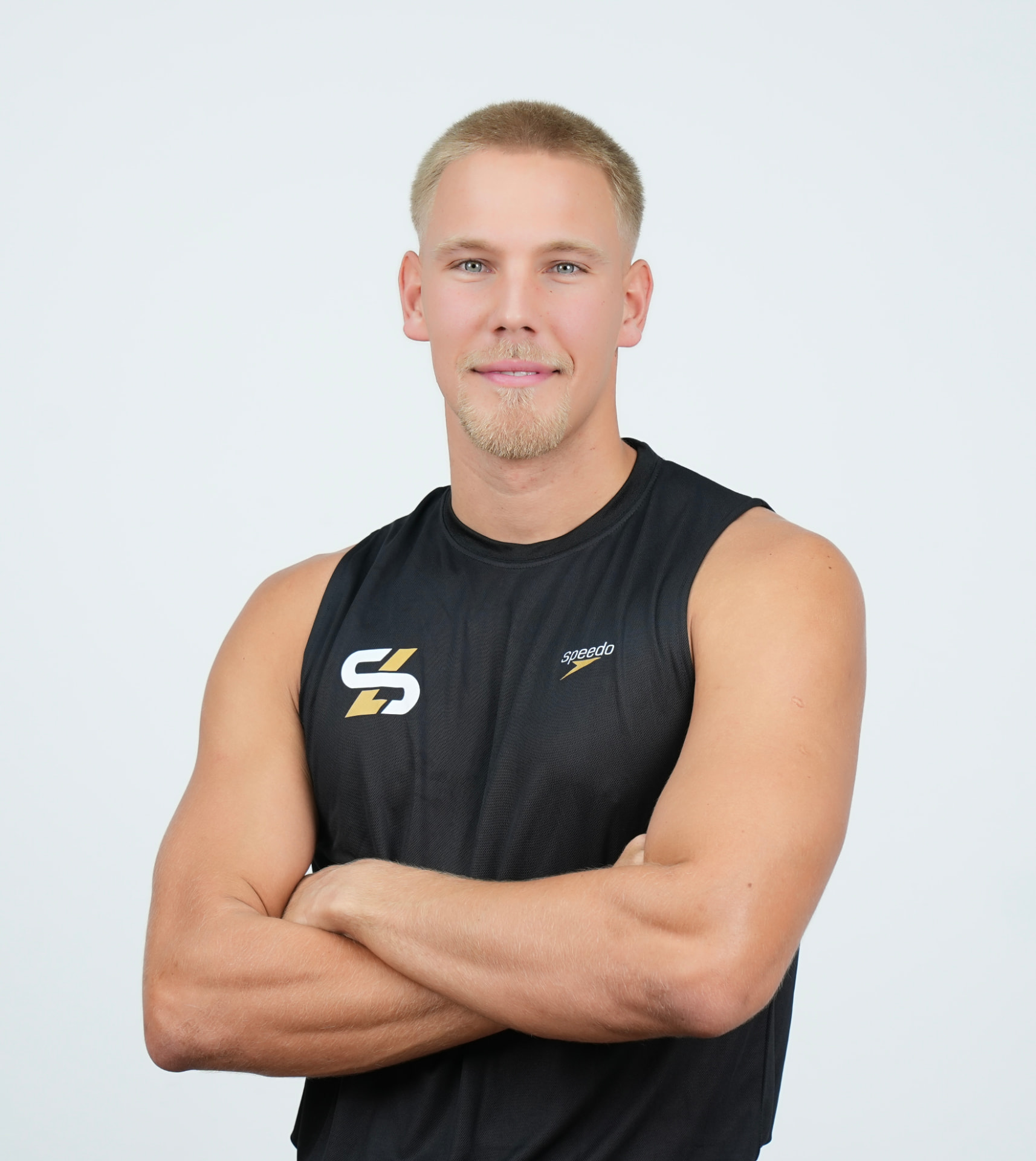 Your coach, former international swimmer, arms crossed
